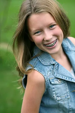 young smiling girl with braces